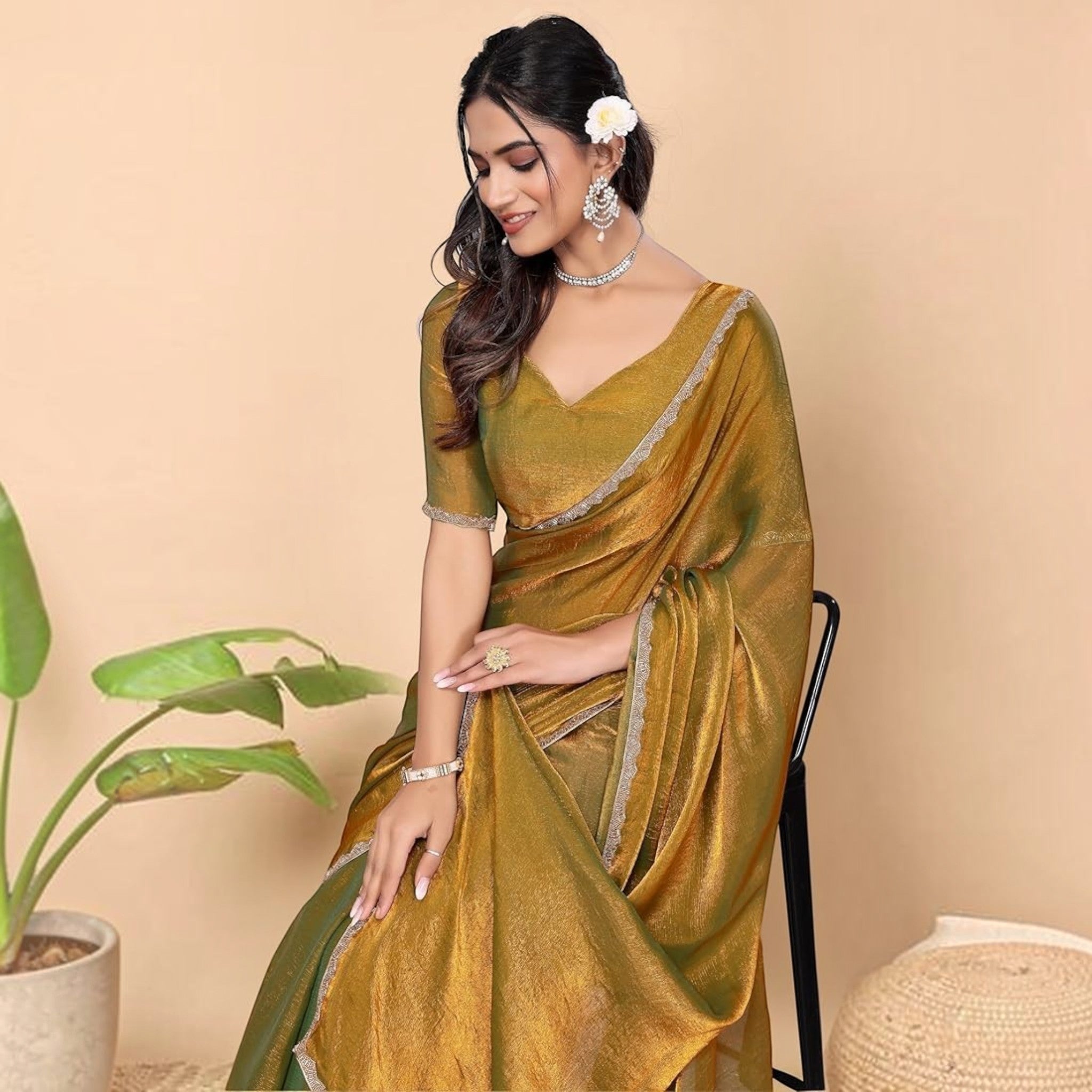 City Center Zimi Zoo collection saree in shimmering olive green georgette with a delicate silver border