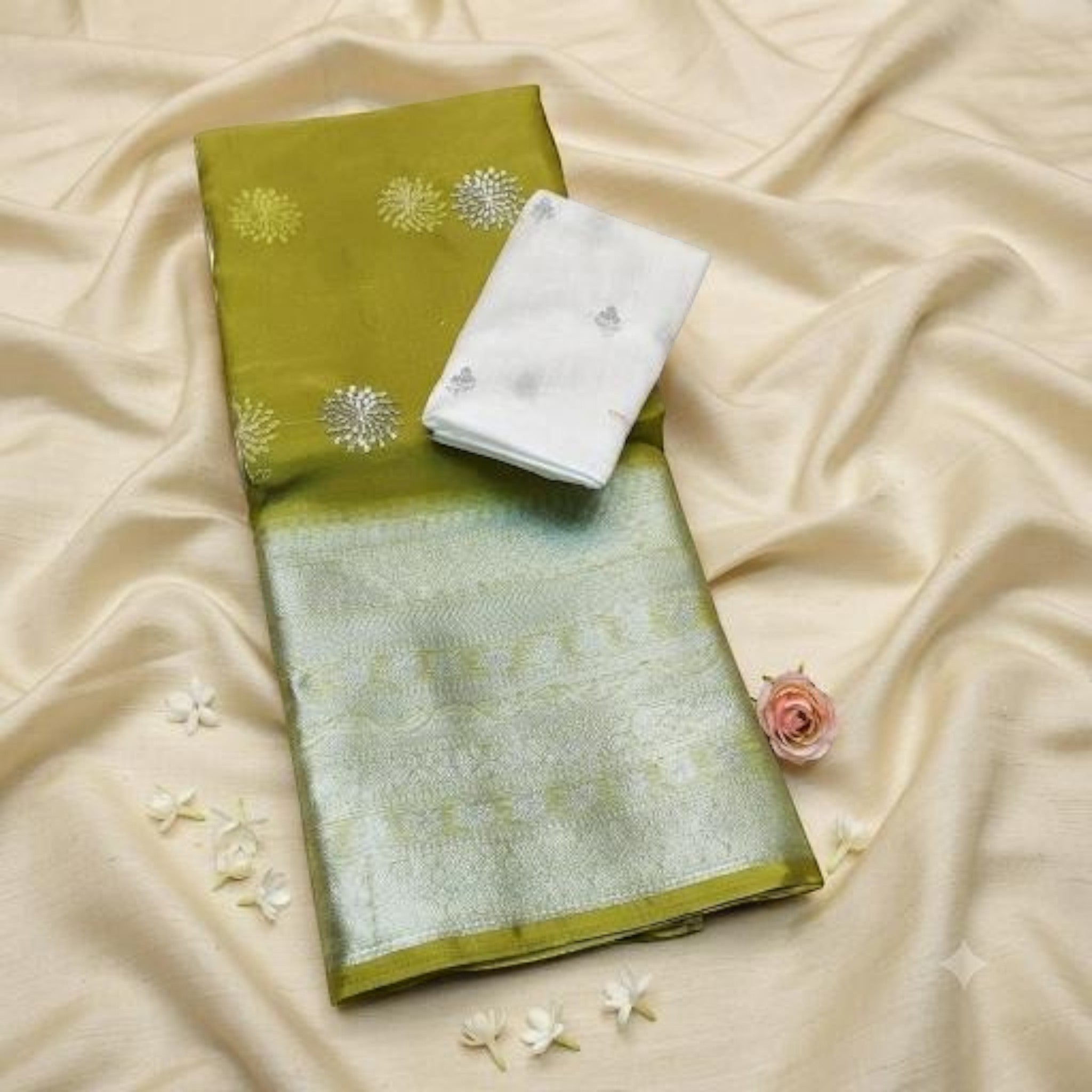 City Center olive green organza saree with silver embroidery and a contrasting white blouse piece on a silk fabric