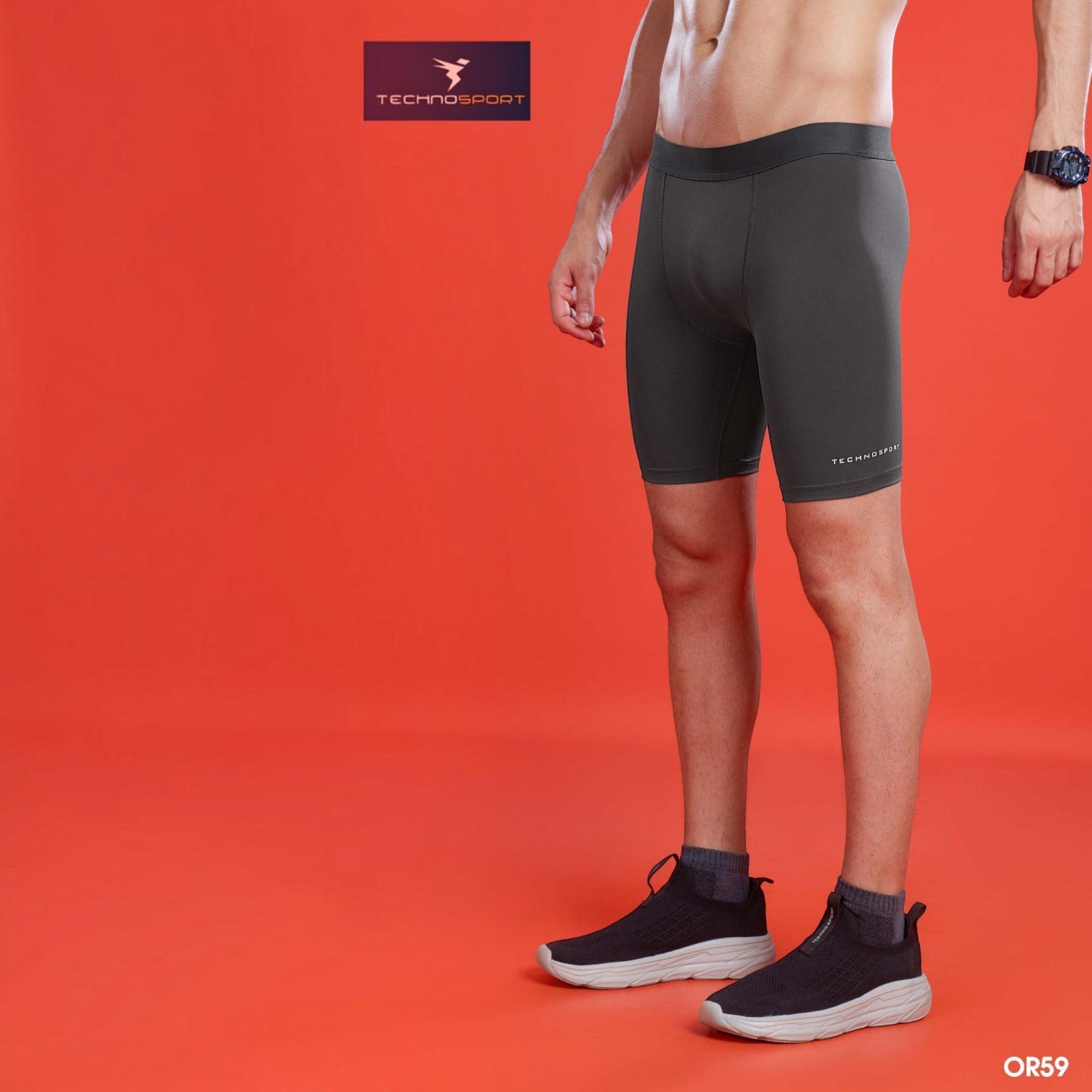 City Center OR59 men's charcoal grey compression shorts with a tailored fit worn by a model on a red background