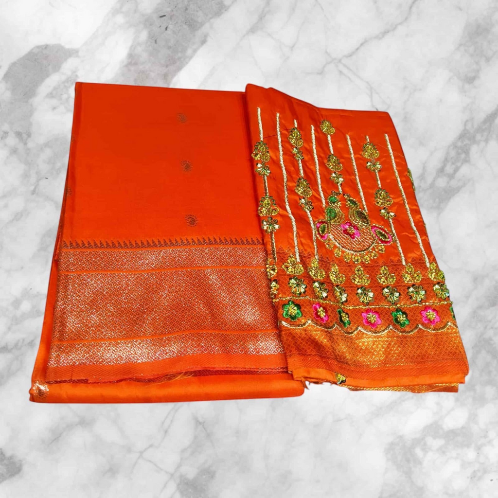 City Center orange saree with a matching blouse featuring intricate gold and multi-colored aari embroidery work.
