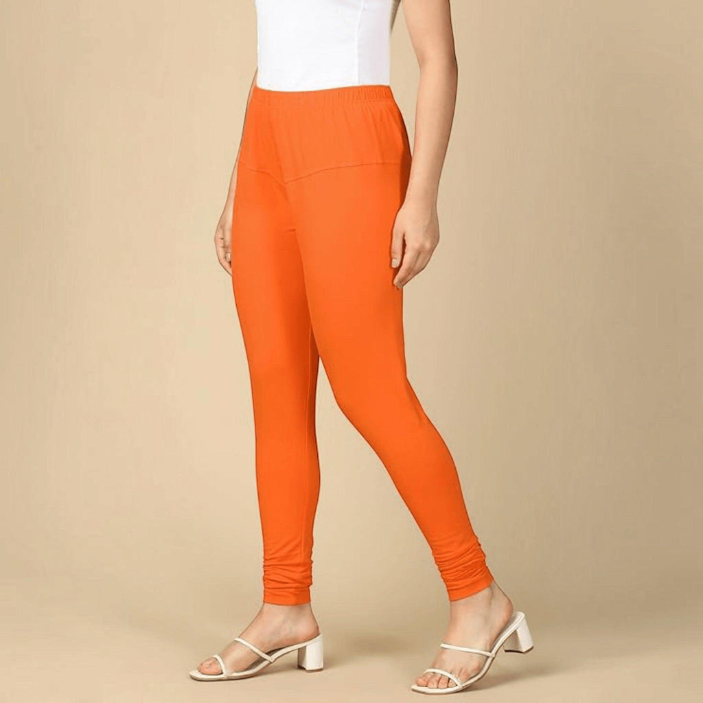 City Center orange cotton lycra churidar leggings for women, featuring a comfortable pull-on design and full length.