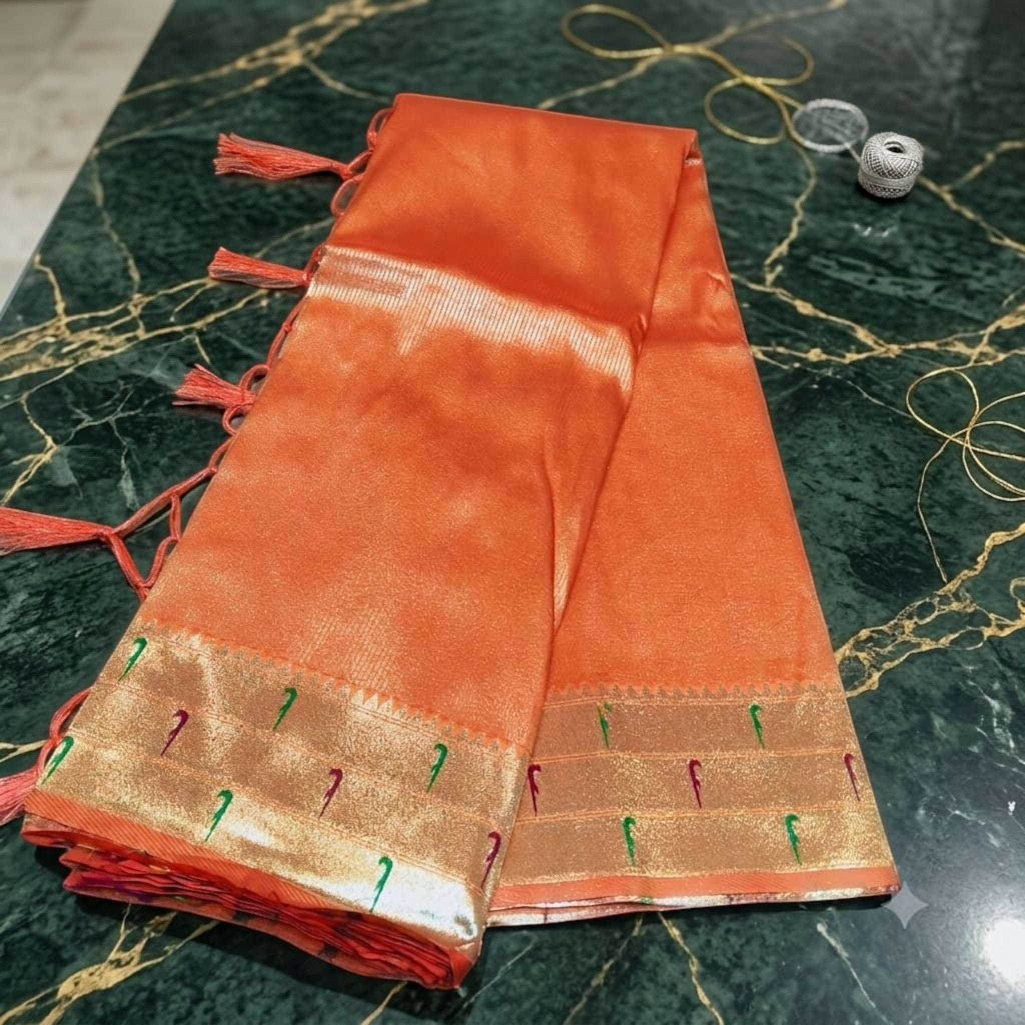 City Center orange silk Muniya Paithani saree featuring gold zari borders and traditional parrot motifs.