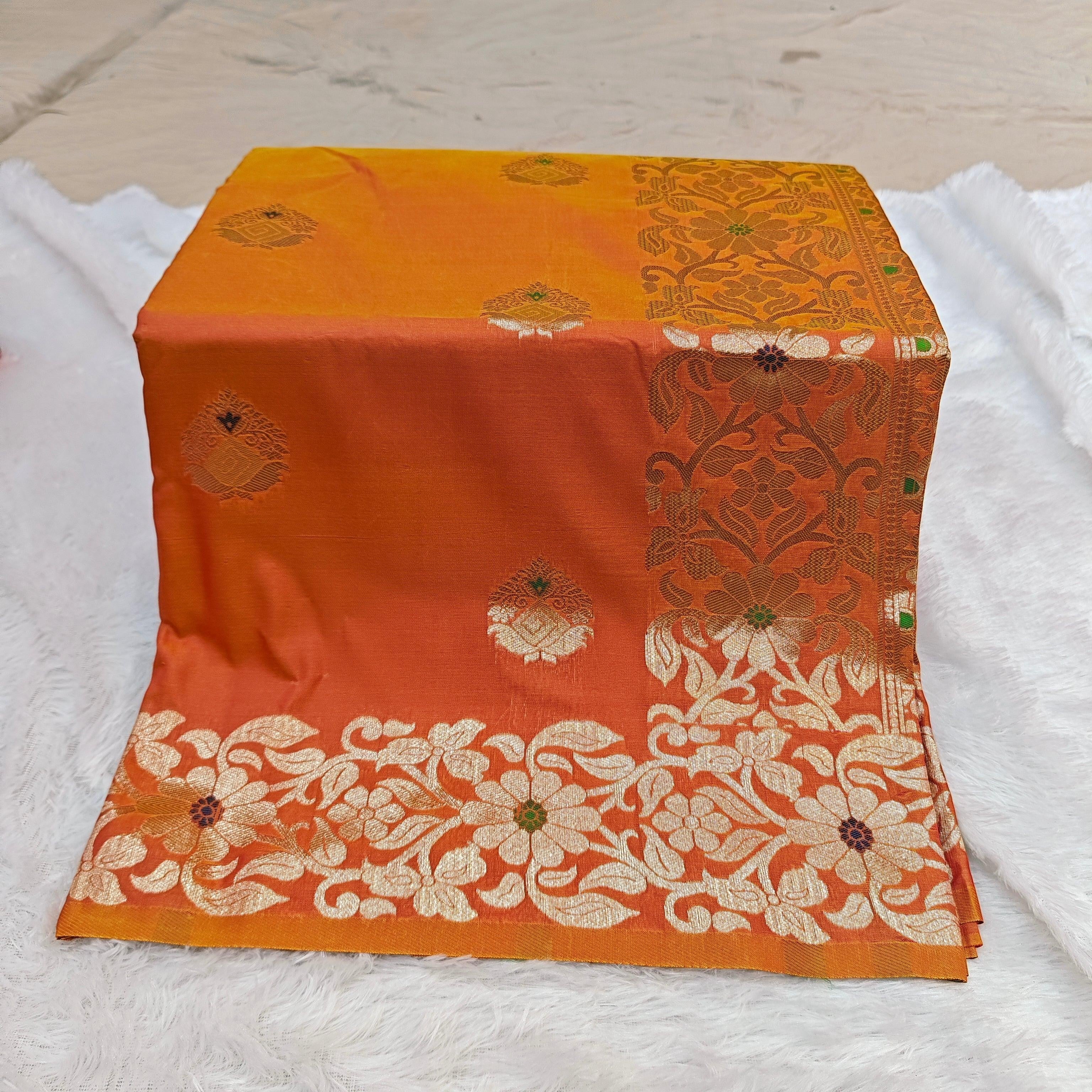 City Center Takshashila silk blend saree in orange with intricate gold zari and multi-color mina floral weave.