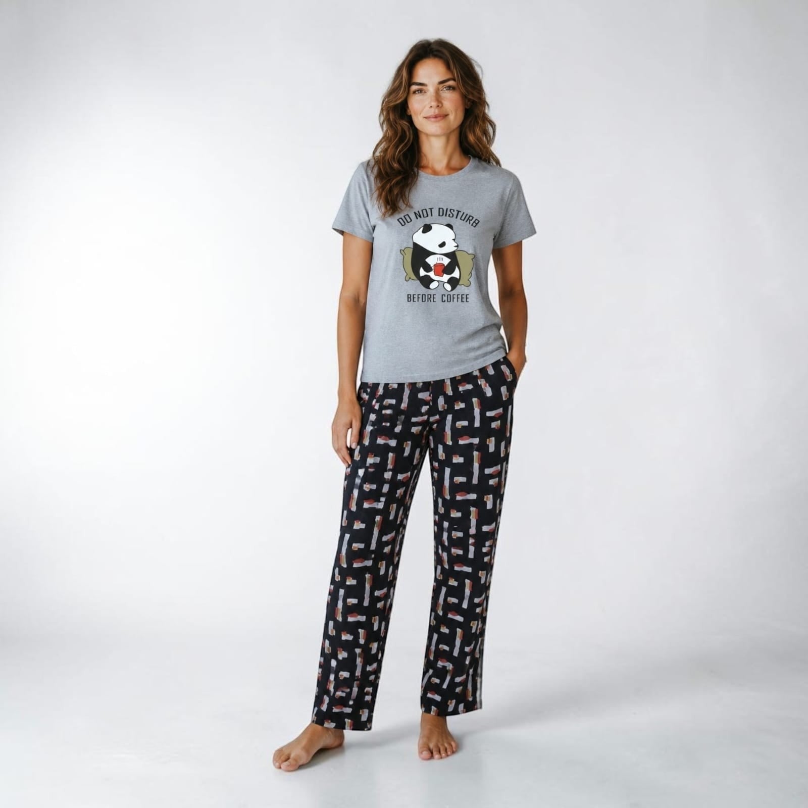 City Center grey t-shirt with panda graphic and patterned lounge pants worn by a woman
