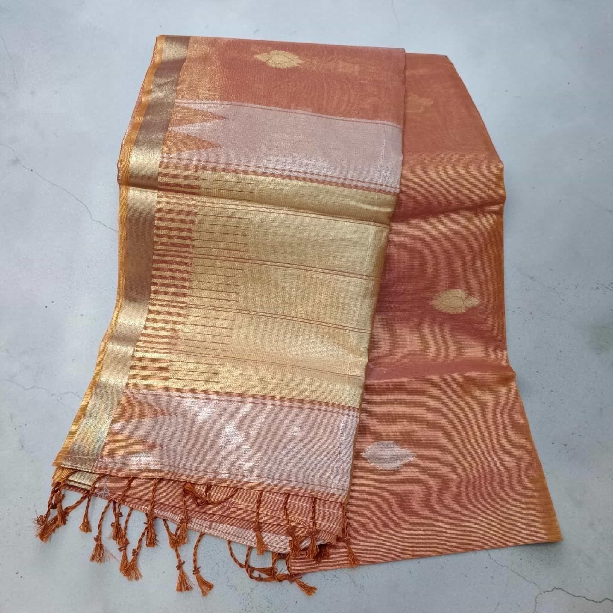 City Center tissue cotton saree in peach with gold zari border and delicate floral motifs, featuring tassel details.