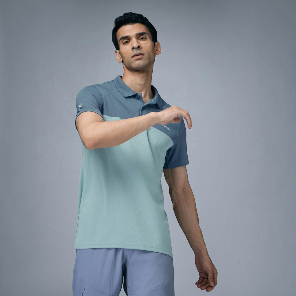 City Center model wearing a two-tone blue and light green performance collar neck t-shirt for sports and training