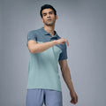 City Center model wearing a two-tone blue and light green performance collar neck t-shirt for sports and training