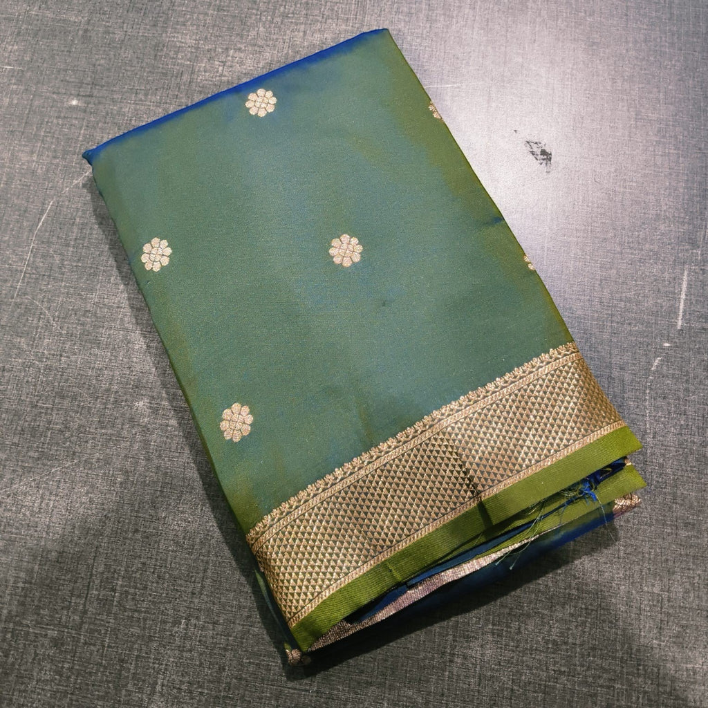 City Center Peshwai saree in deep green silk with gold floral motifs and a traditional ornate zari border