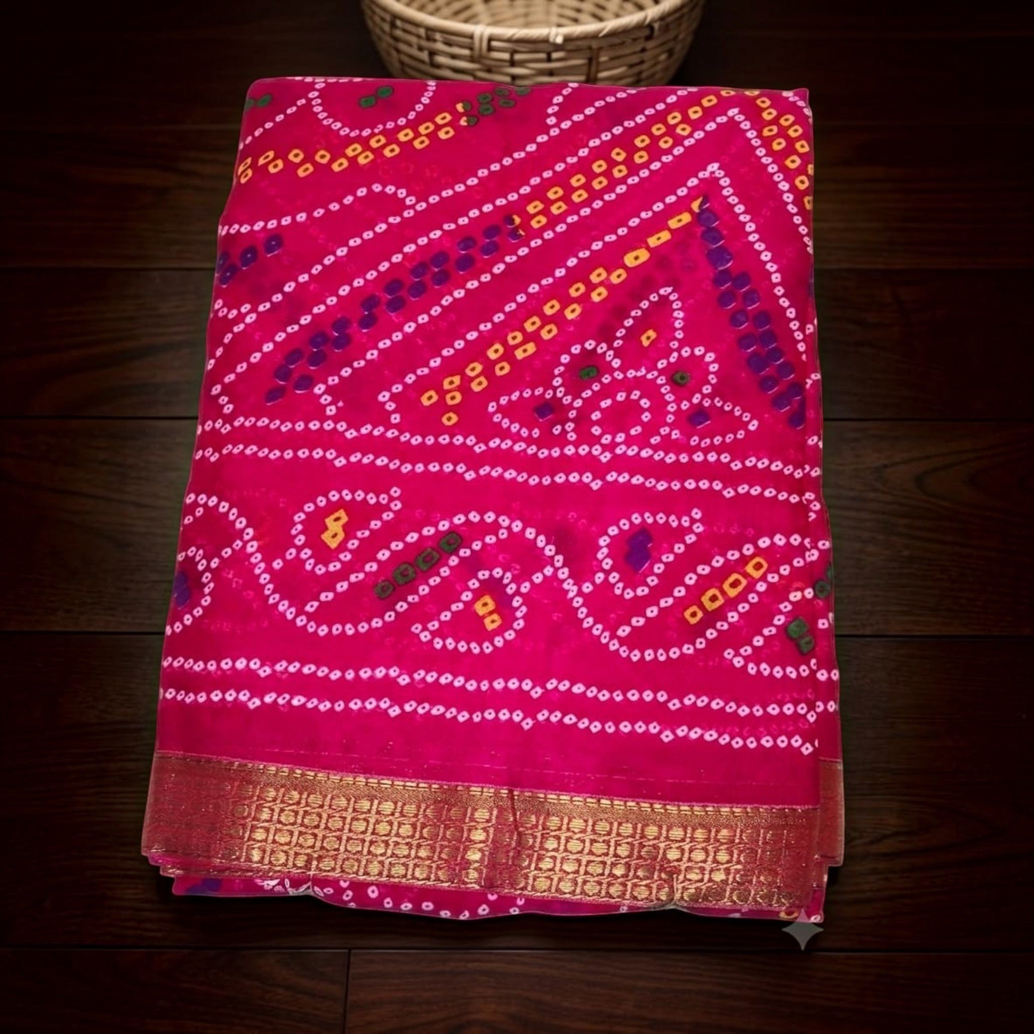 City Center Bandhan silk saree in vibrant pink with traditional bandhani tie-dye patterns and a gold woven border.