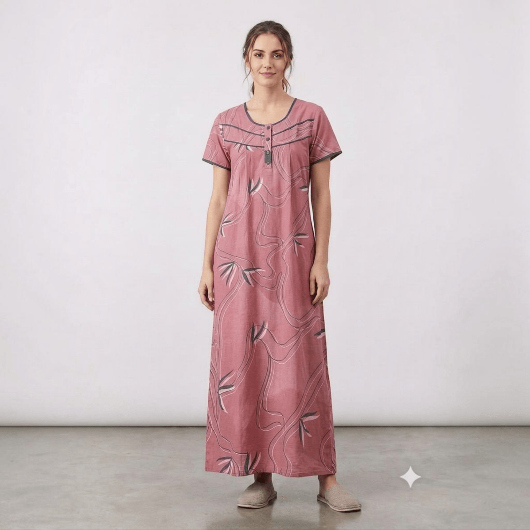 City Center women's pink cotton feeding gown with floral line art, front pleats, and intricate neck embroidery.