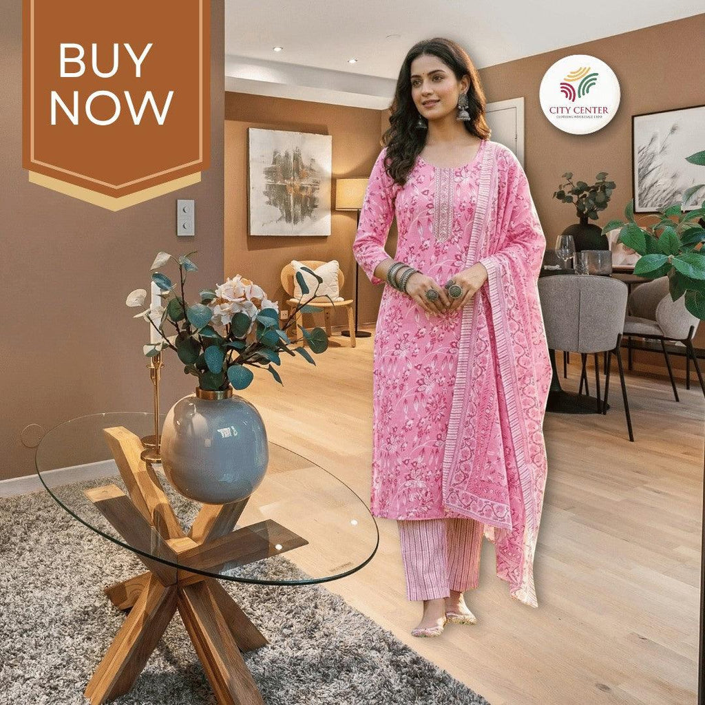 City Center pink cotton kurti set with heritage Jaipuri floral print, worn by a model in a modern living room.