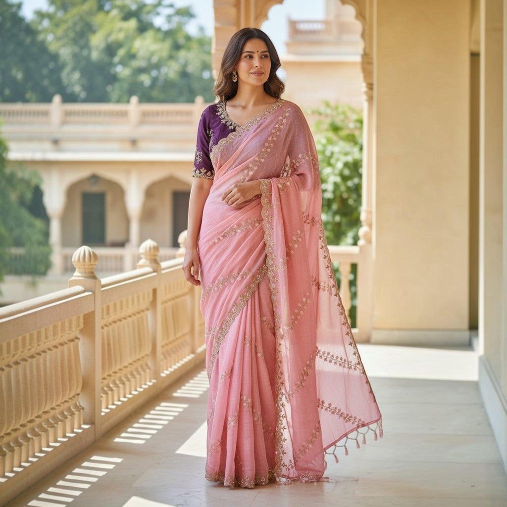 City Center pink organza saree with intricate beadwork and a contrasting purple embroidered blouse worn by a woman