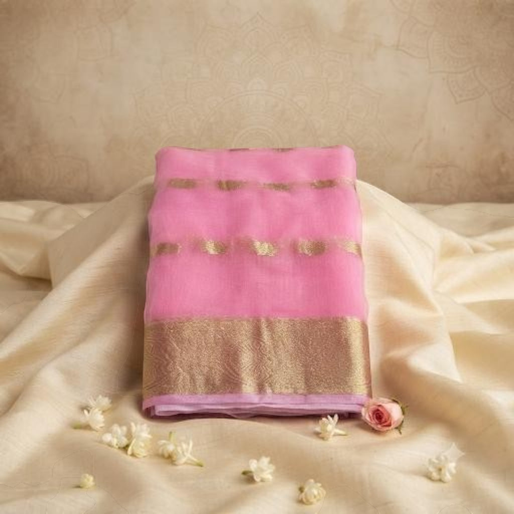 City Center pink organza saree with gold beet work embroidery and a contrast blouse piece on a cream fabric backdrop