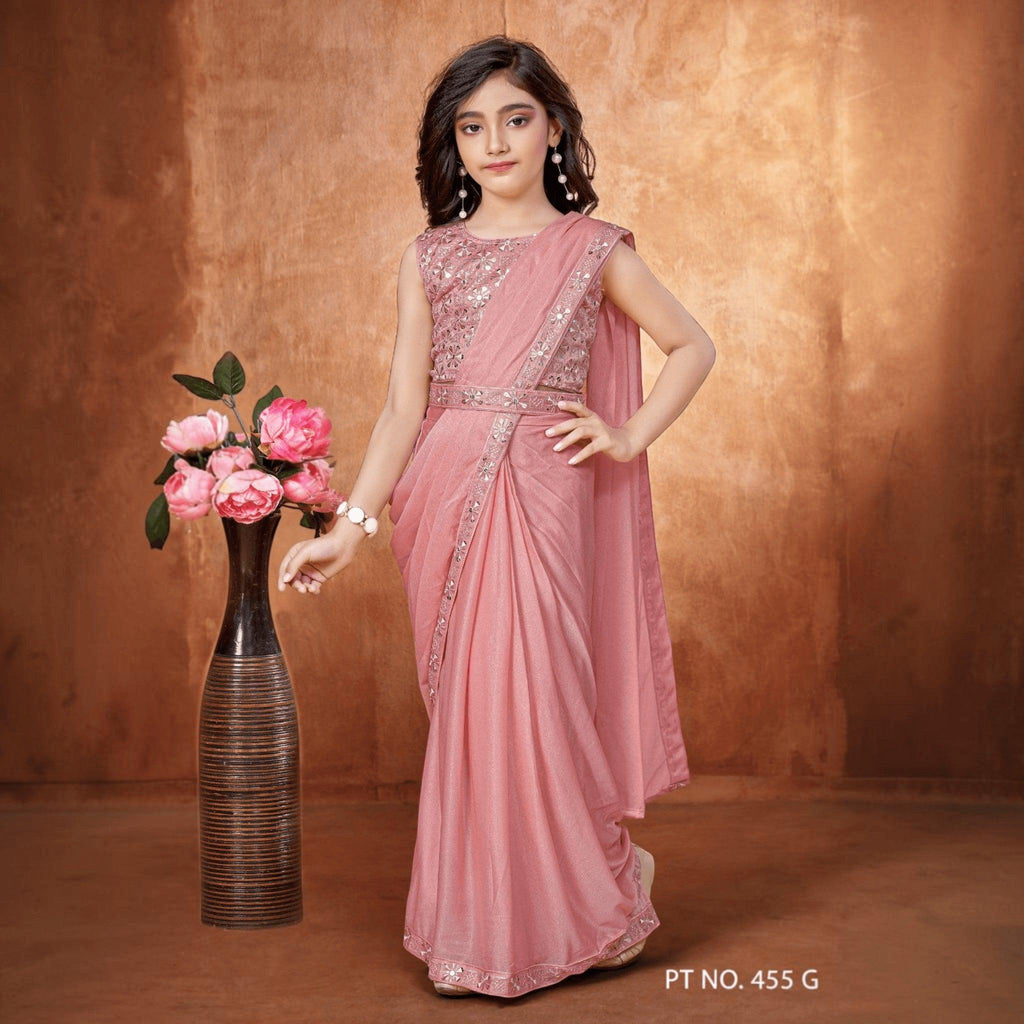 City Center girl wearing a dusty pink shimmer lycra ready-to-wear saree with an embroidered sleeveless blouse
