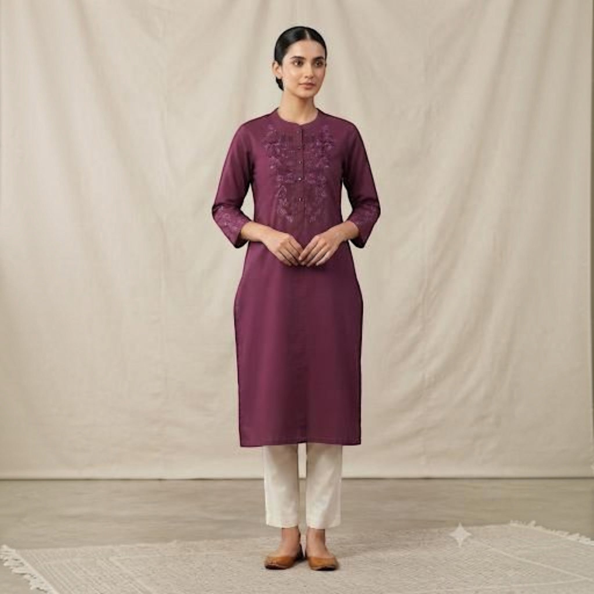 City Center premium plum straight kurti with intricate embroidery, paired with cream trousers for an elegant look.
