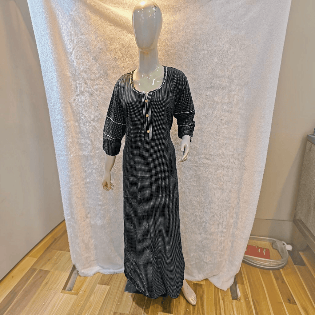 City Center black and white polka dot heavy rayon A-line gown with three-quarter sleeves on a mannequin