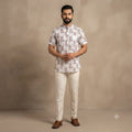 City Center short kurta in white with maroon bicycle print, featuring a mandarin collar and short sleeves on a model