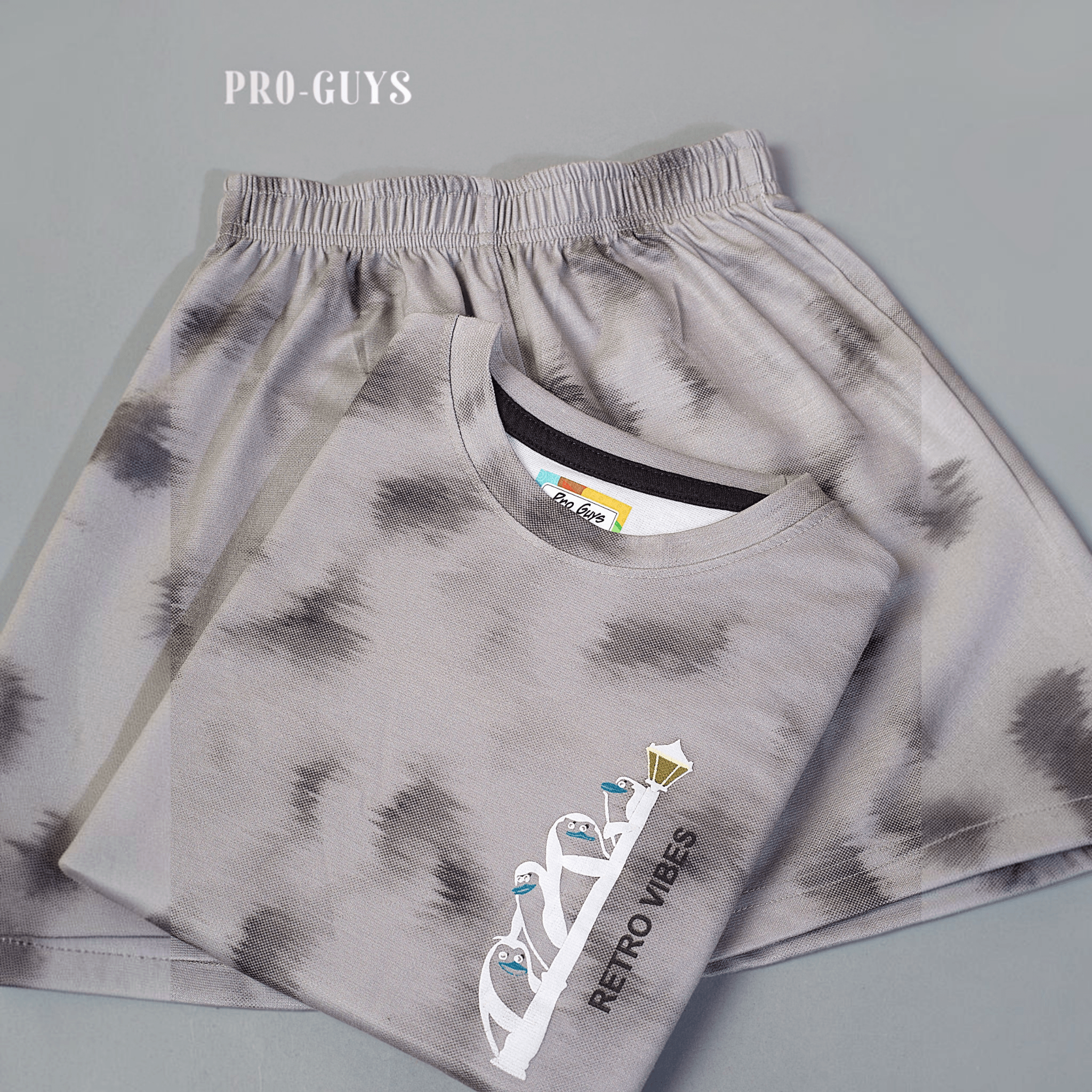 City Center Pro-Guys kids grey tie-dye cotton t-shirt and shorts set with Retro Vibes penguin graphic print