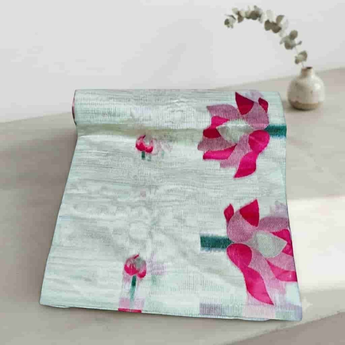 City Center pure cotton saree in light grey with vibrant pink lotus flower motifs and a soft textured weave.