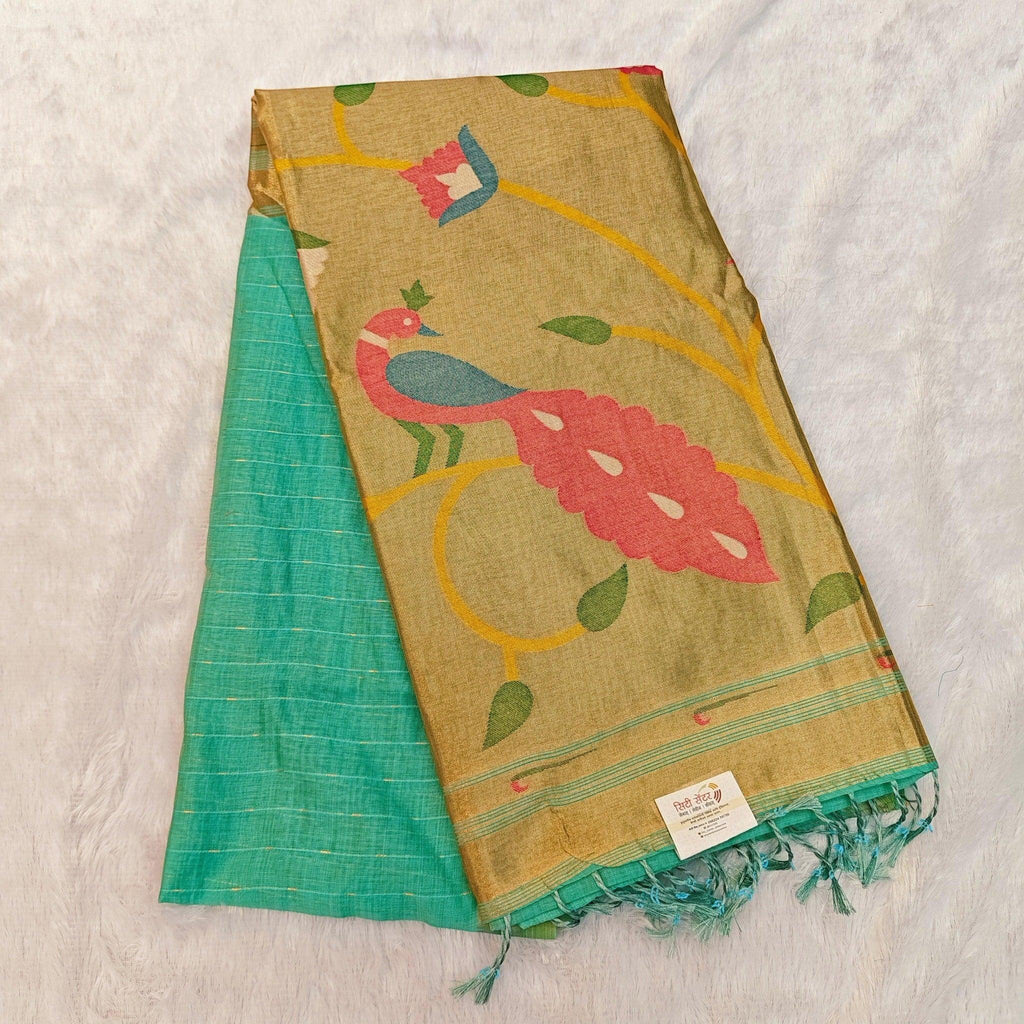 City Center pure silk Jamdani saree featuring a gold zari pallu with peacock motifs and green fabric with zari lines.