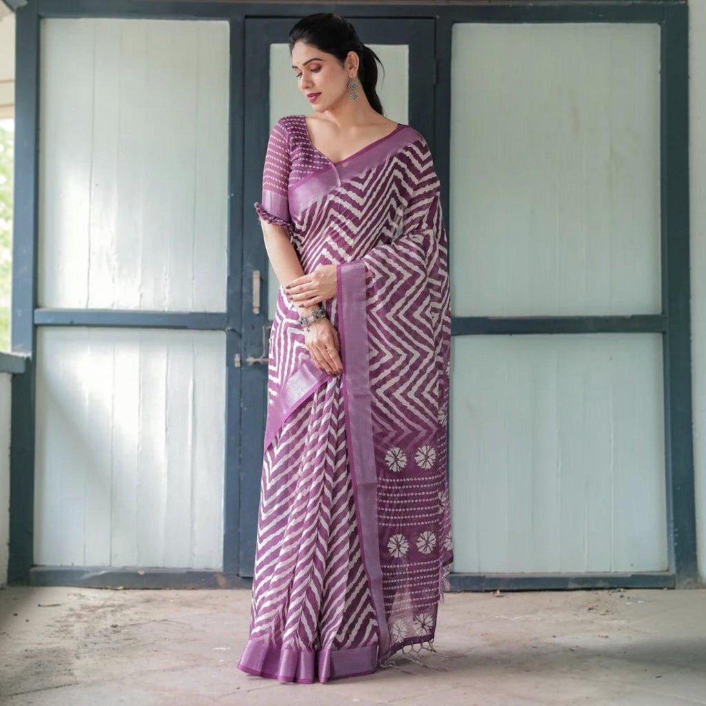 City Center premium cotton saree in purple with white chevron patterns and floral border, worn by a woman.