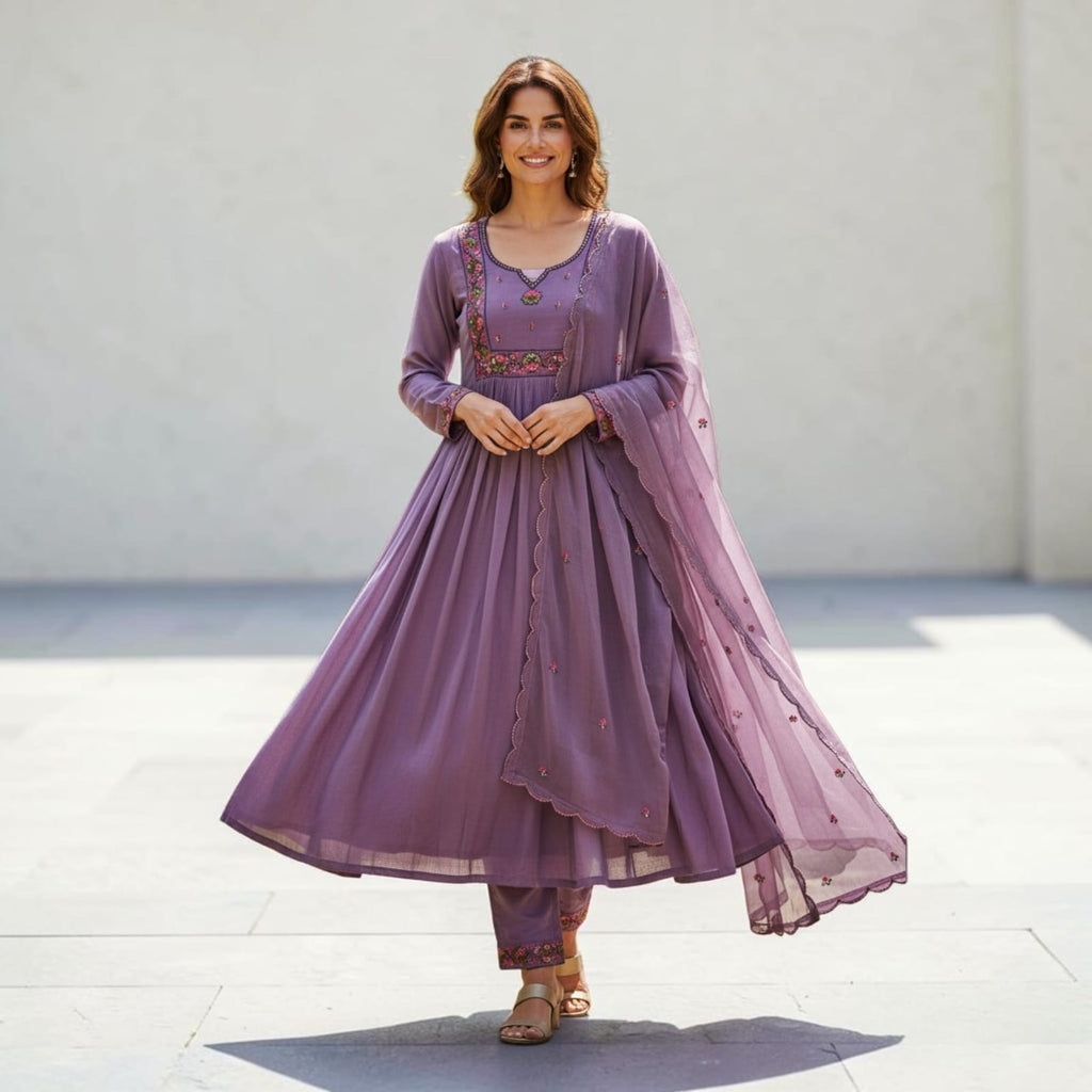 City Center purple denim kurti with floral embroidery, matching trousers, and sheer dupatta worn by a smiling woman