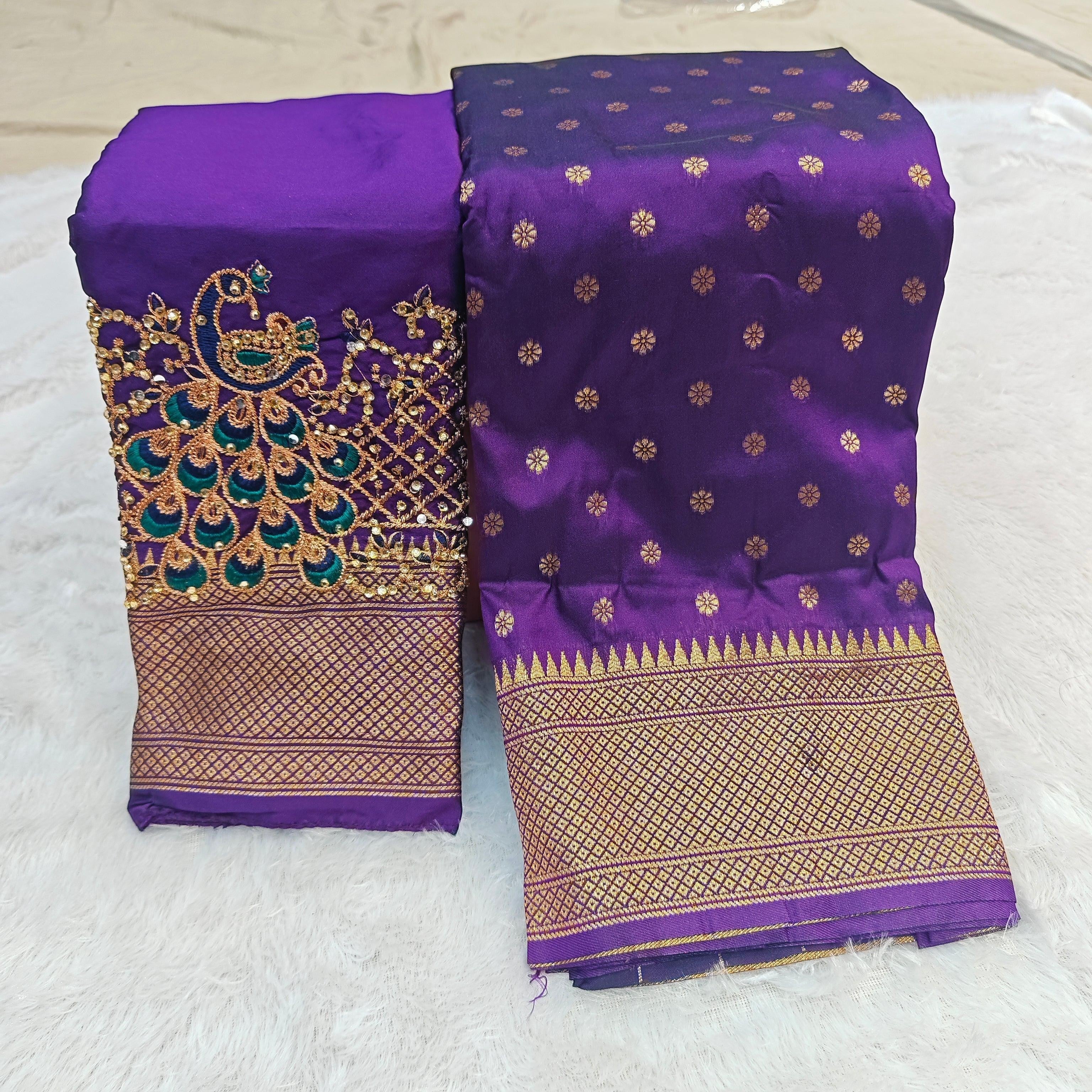 City Center purple Kalanjali silk saree with gold woven border and matching blouse featuring intricate peacock Aari work