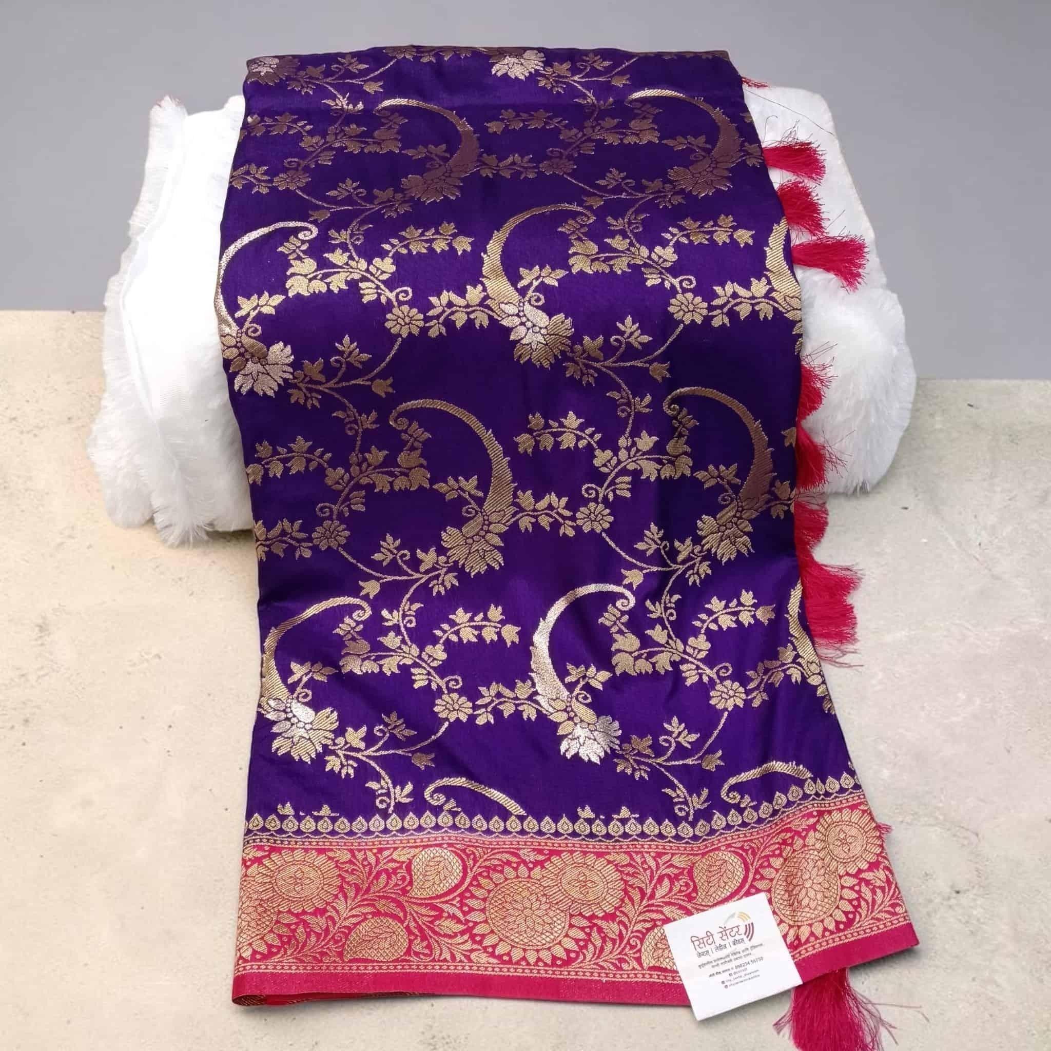 City Center purple Kathpadar Peshwai saree with gold floral motifs, Swarovski crystals, and a vibrant pink border.