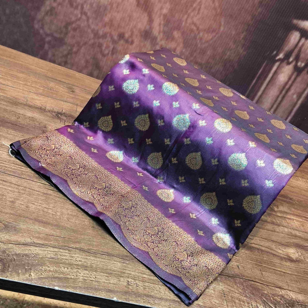 City Center purple Kathpadar saree with intricate gold zari motifs and a detailed traditional border