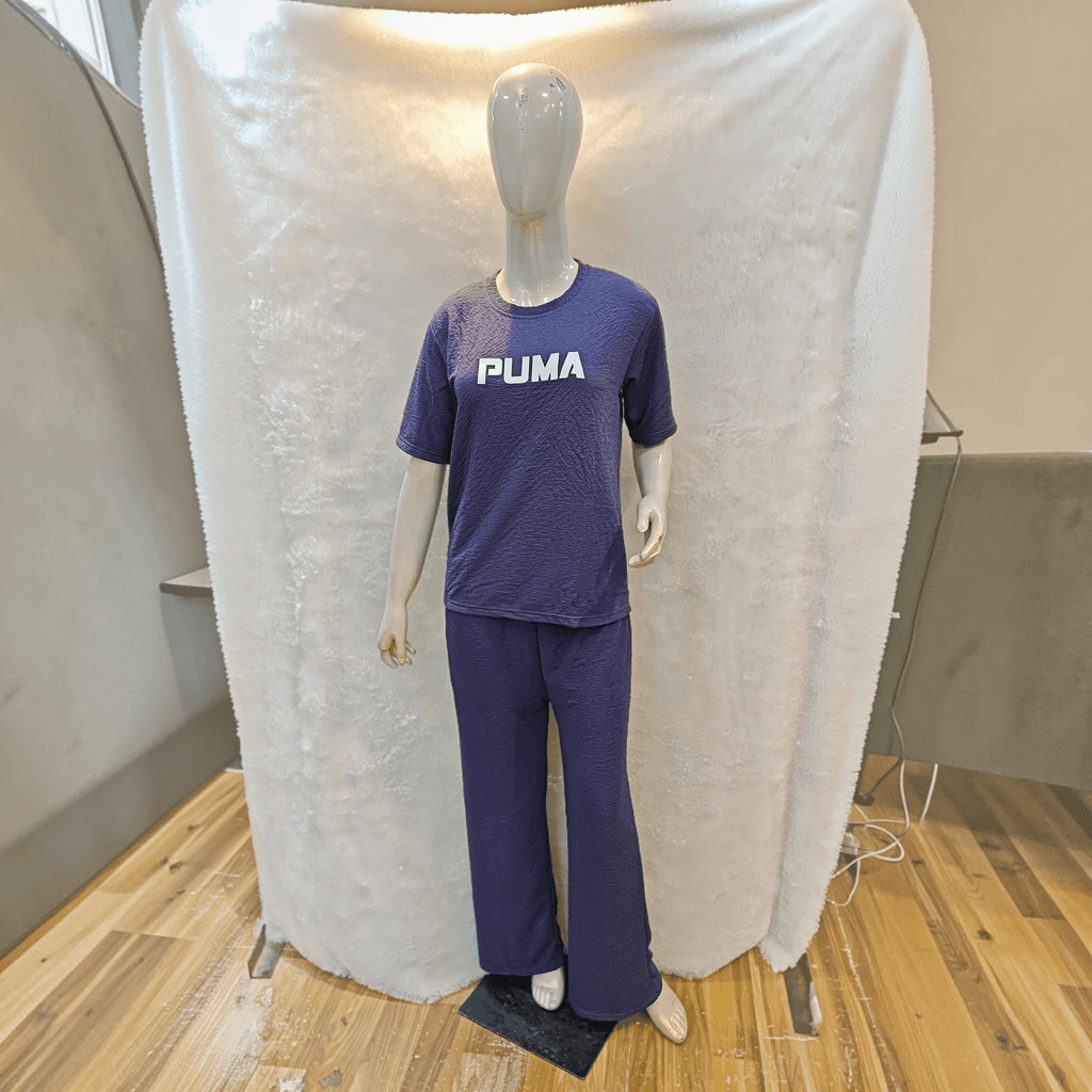 City Center purple Korean airport cord set with short sleeves and relaxed fit trousers on a mannequin