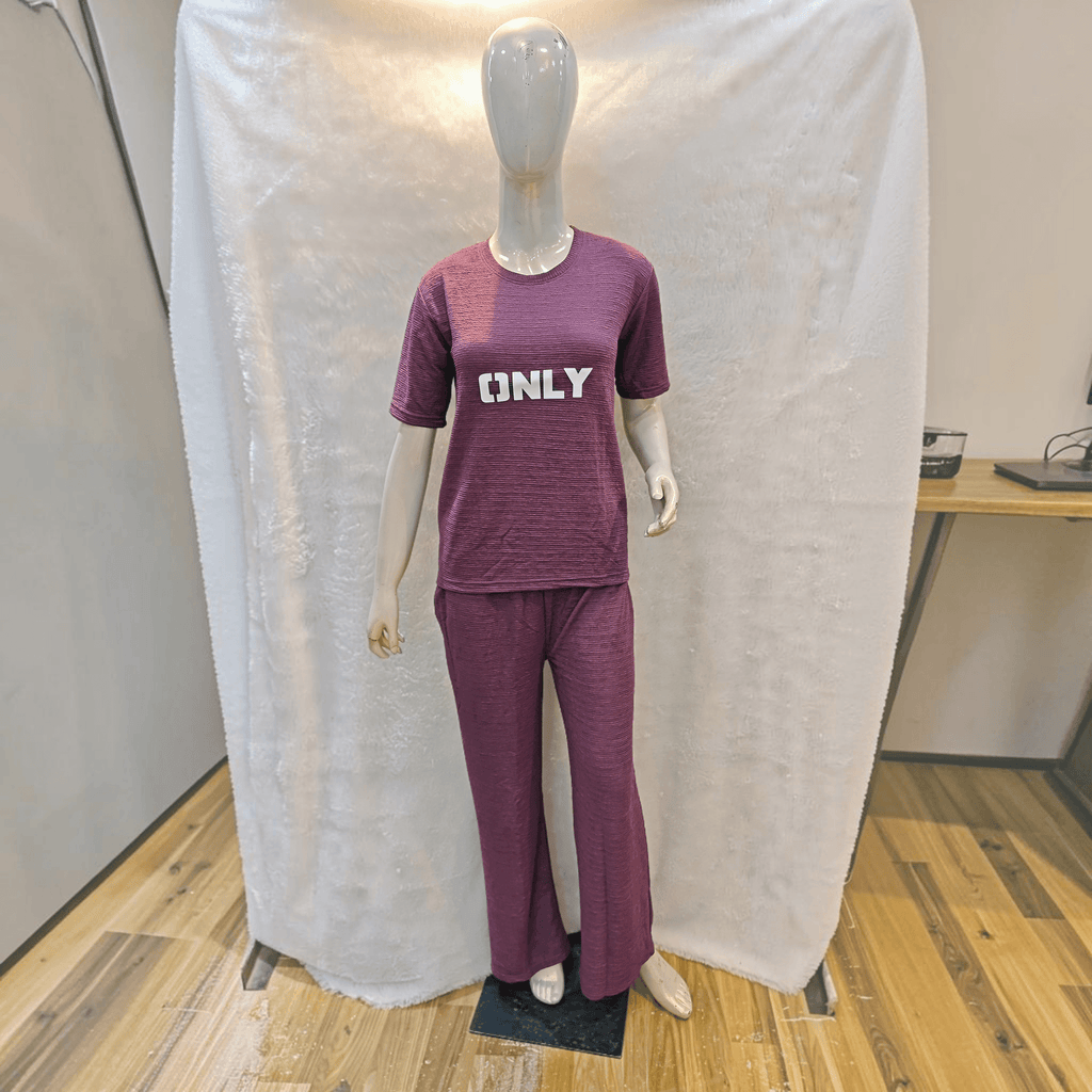 City Center purple Korean airport cord set with short sleeves and relaxed fit trousers on a mannequin