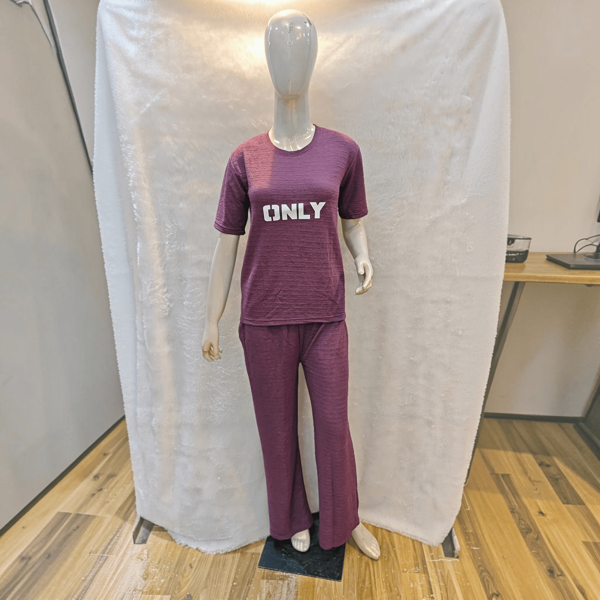 City Center purple Korean airport cord set with short sleeves and relaxed fit trousers on a mannequin