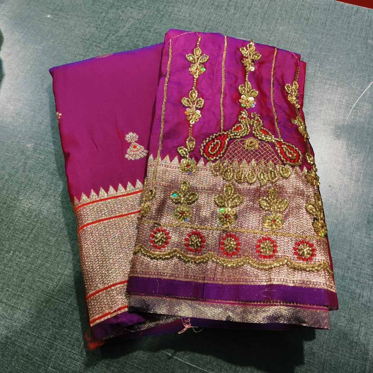 City Center purple Jhumka Paithani saree with intricate gold Aariwork embroidery on the blouse for festive wear.
