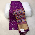 City Center purple silk cotton Patola saree with intricate geometric ikat patterns and a gold zari border.