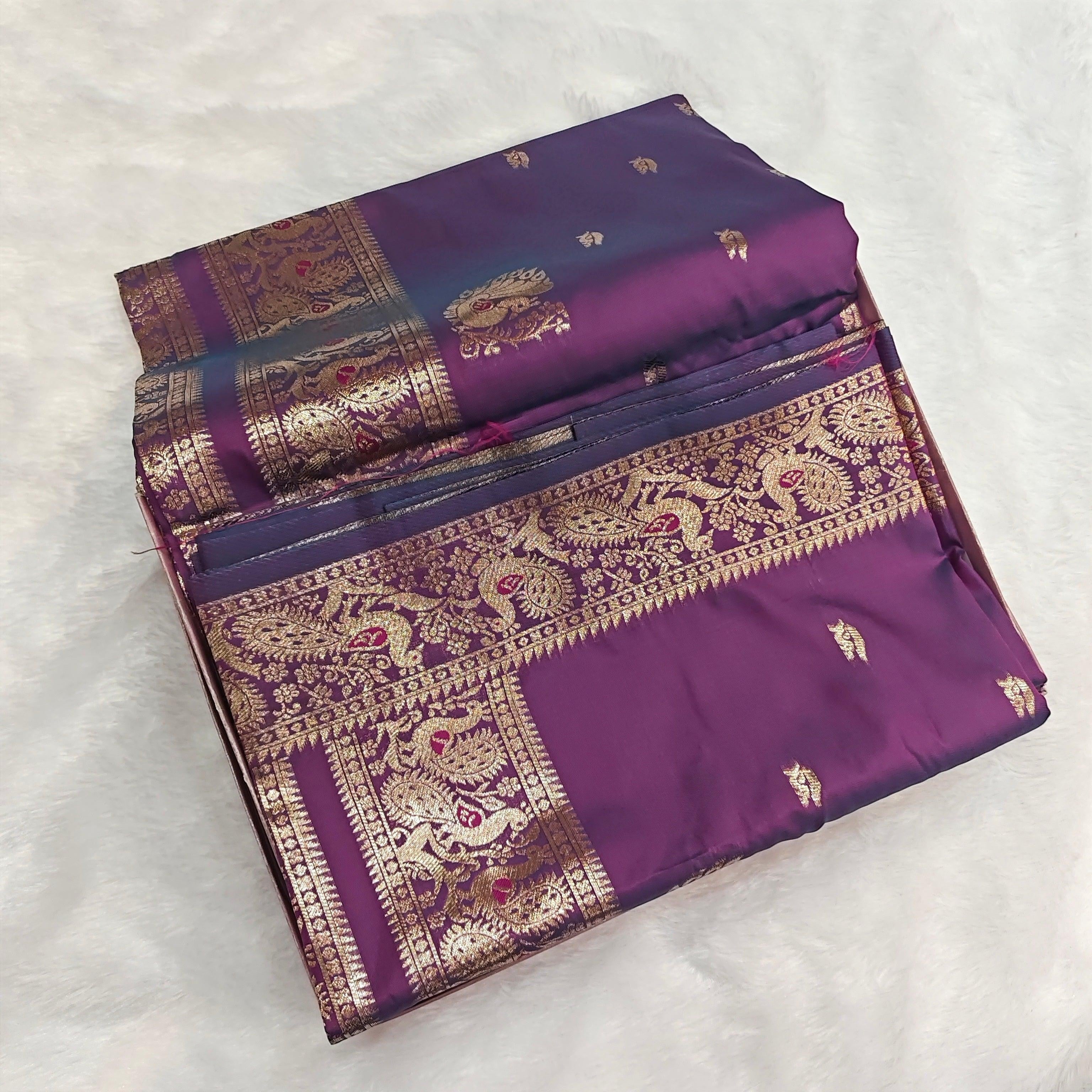 City Center premium dual-tone purple silk saree with intricate gold zari border and traditional motifs