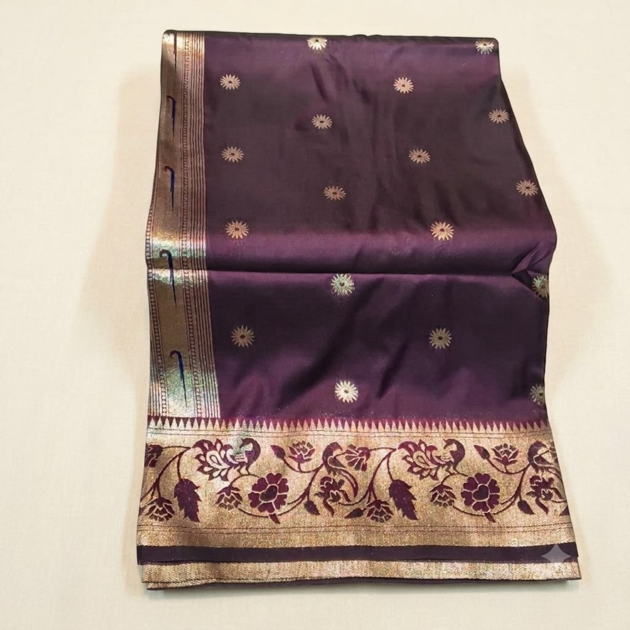 City Center purple pure silk Muniya Paithani saree featuring intricate gold zari parrot motifs and floral border