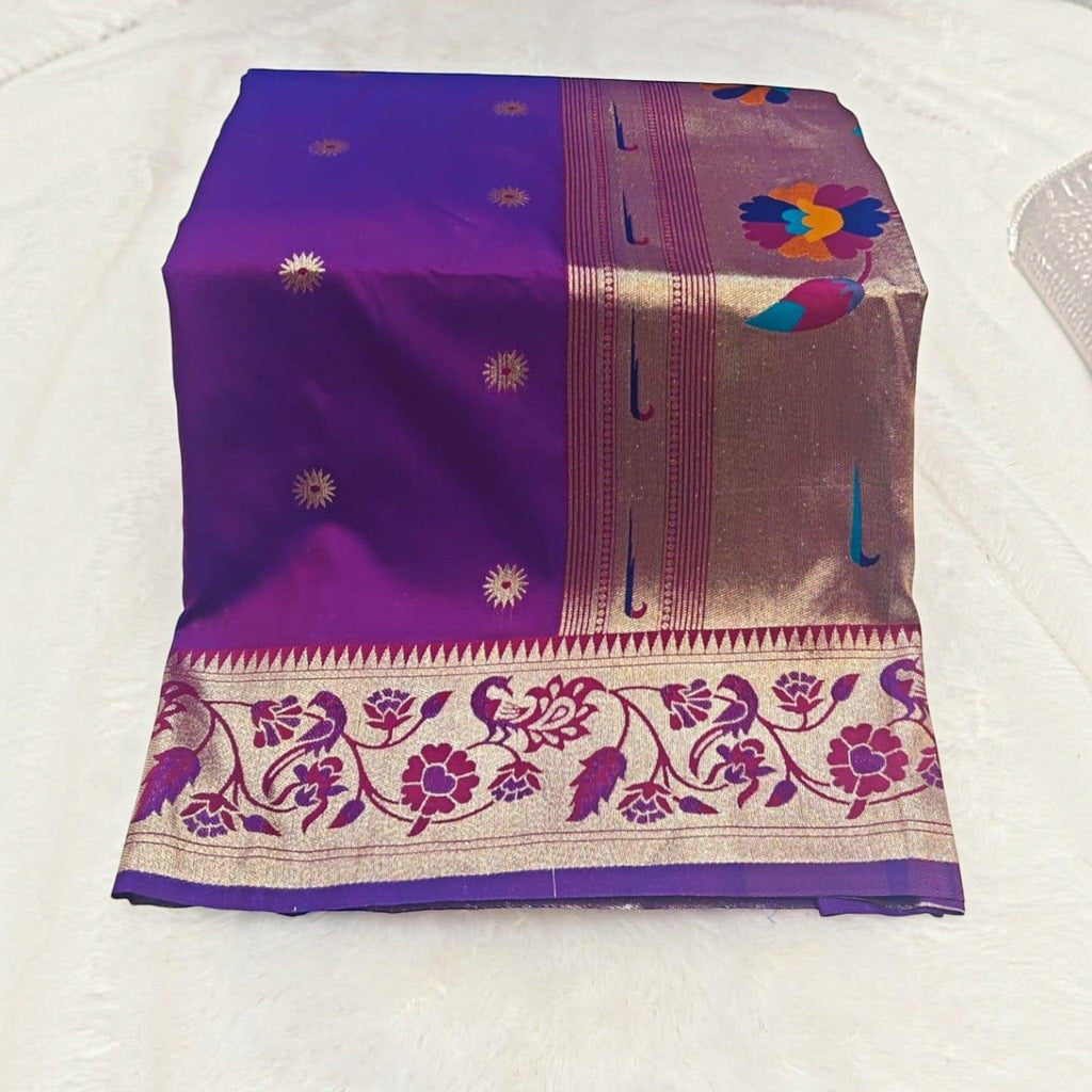 City Center traditional purple silk saree with a wide gold border featuring intricate floral and peacock motifs.