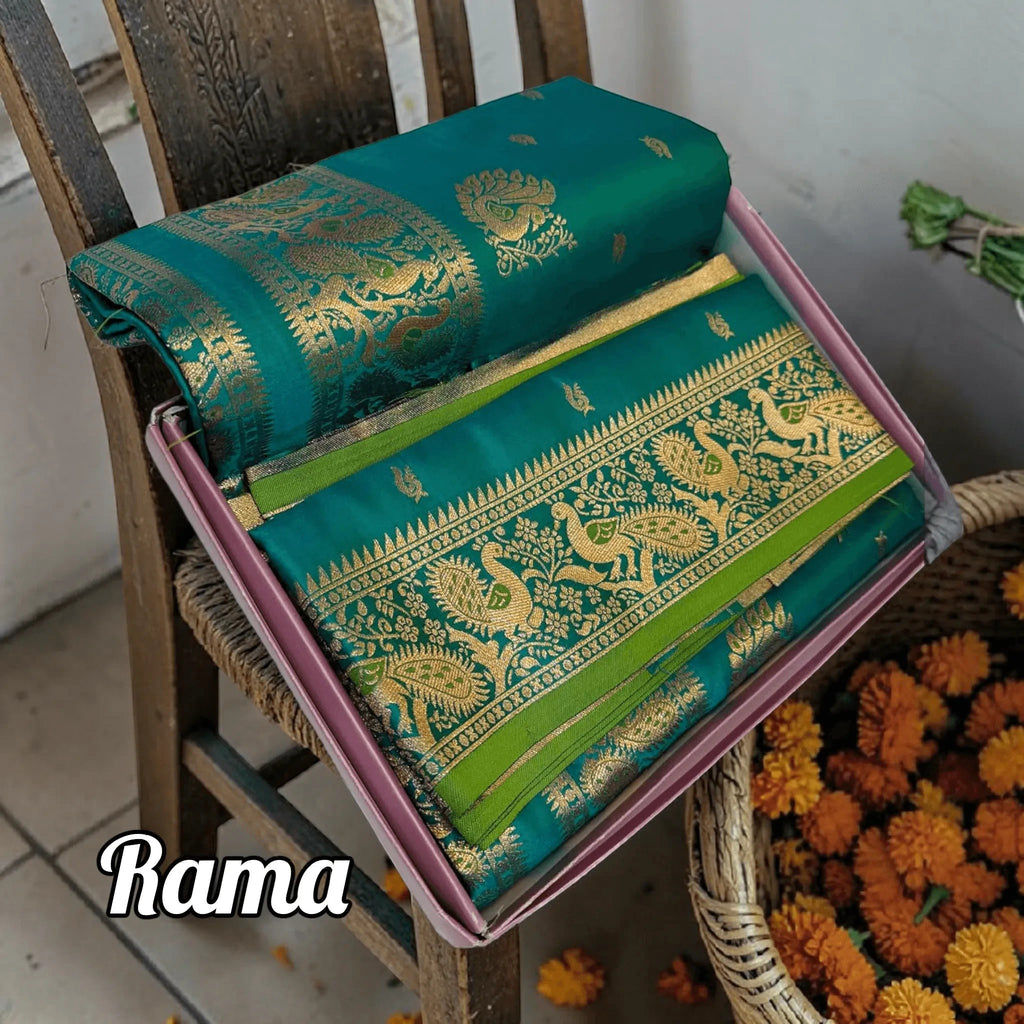 City Center handwoven Rama green Peshwai Paithani silk saree with intricate gold zari peacock motifs on a heavy pallu.
