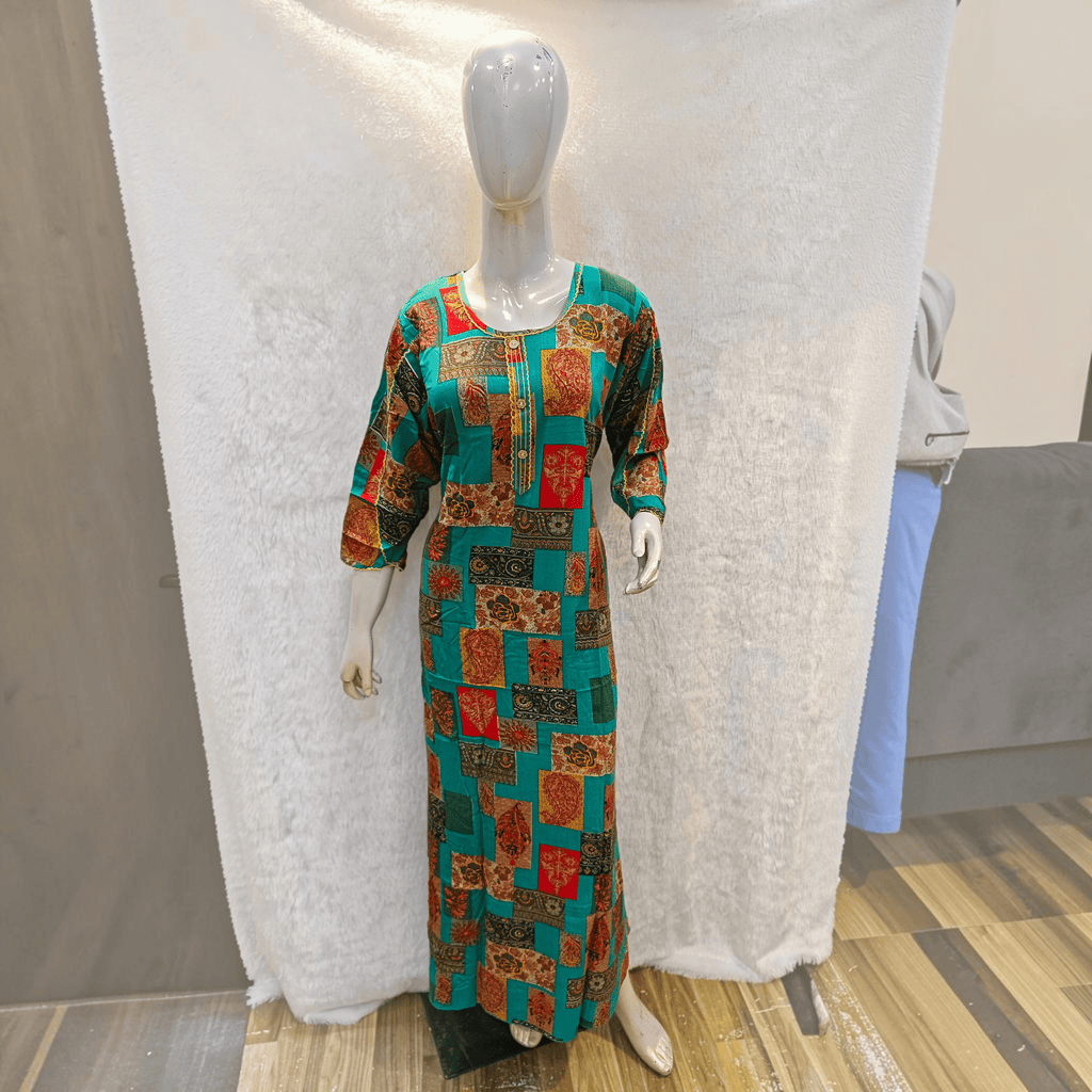 City Center heavy rayon A-line gown featuring a vibrant teal and multi-colored patchwork print on a mannequin.