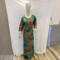 City Center heavy rayon A-line gown featuring a vibrant teal and multi-colored patchwork print on a mannequin.