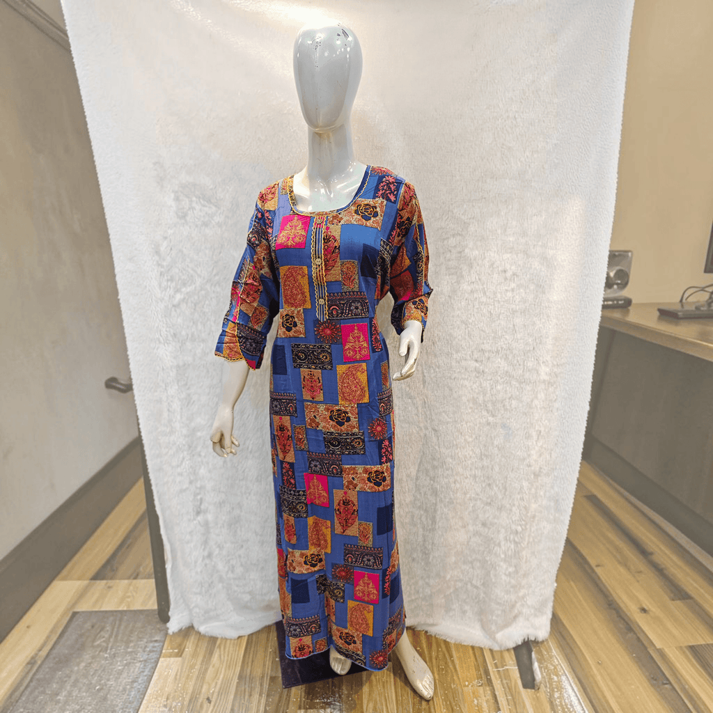 City Center heavy rayon A-line gown featuring a vibrant blue patchwork print with pink and orange floral patterns.