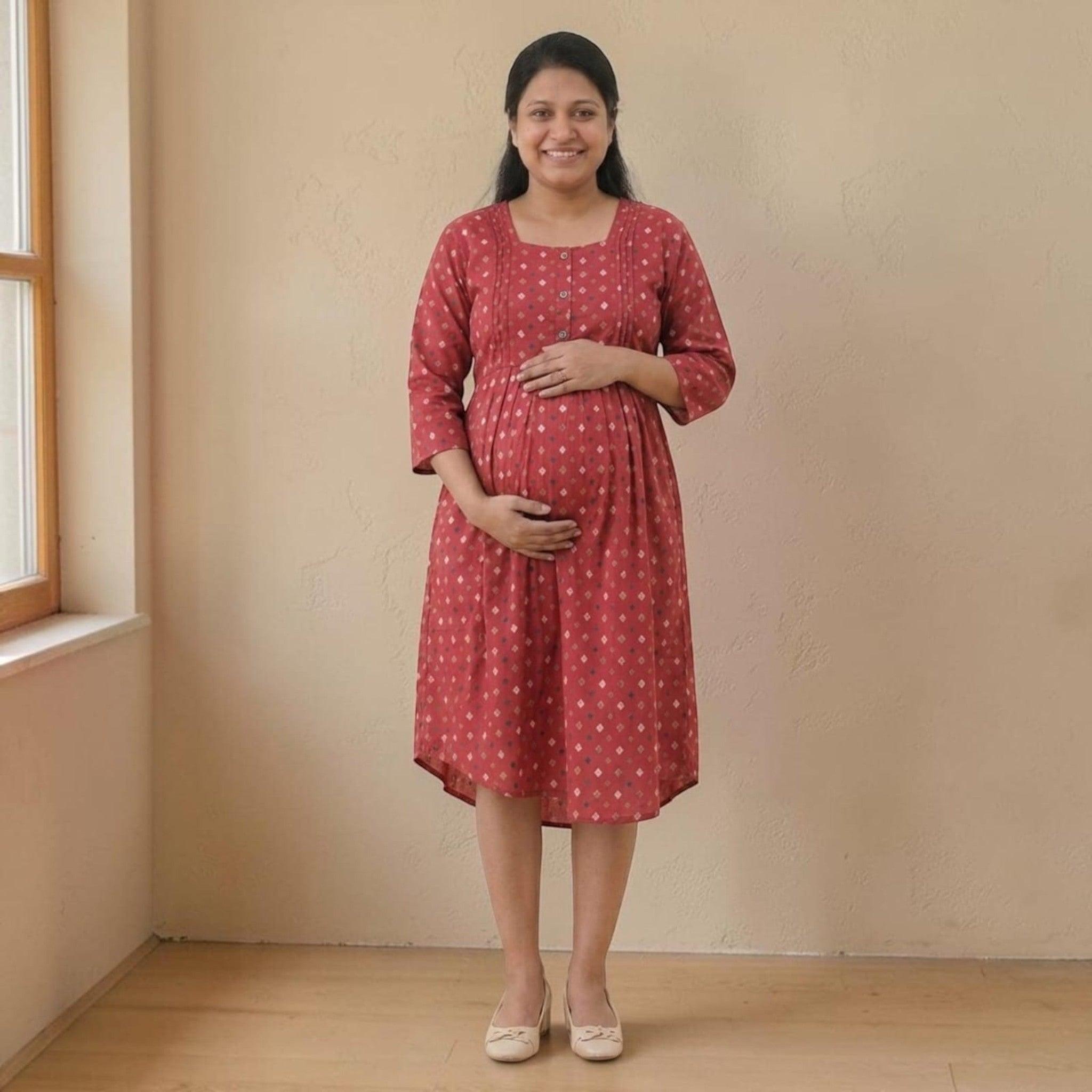 City Center maternity and nursing gown in red cotton with a geometric print, featuring concealed feeding zippers.