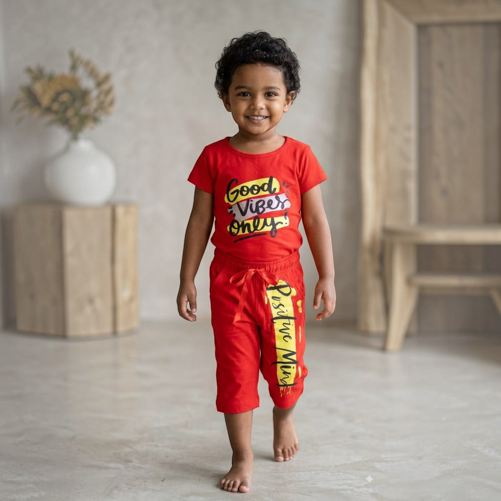 City Center kids red co-ord set with Good Vibes Only graphic print worn by a smiling toddler girl