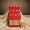 City Center red organza saree featuring intricate gold beet work embroidery and a wide traditional zari border