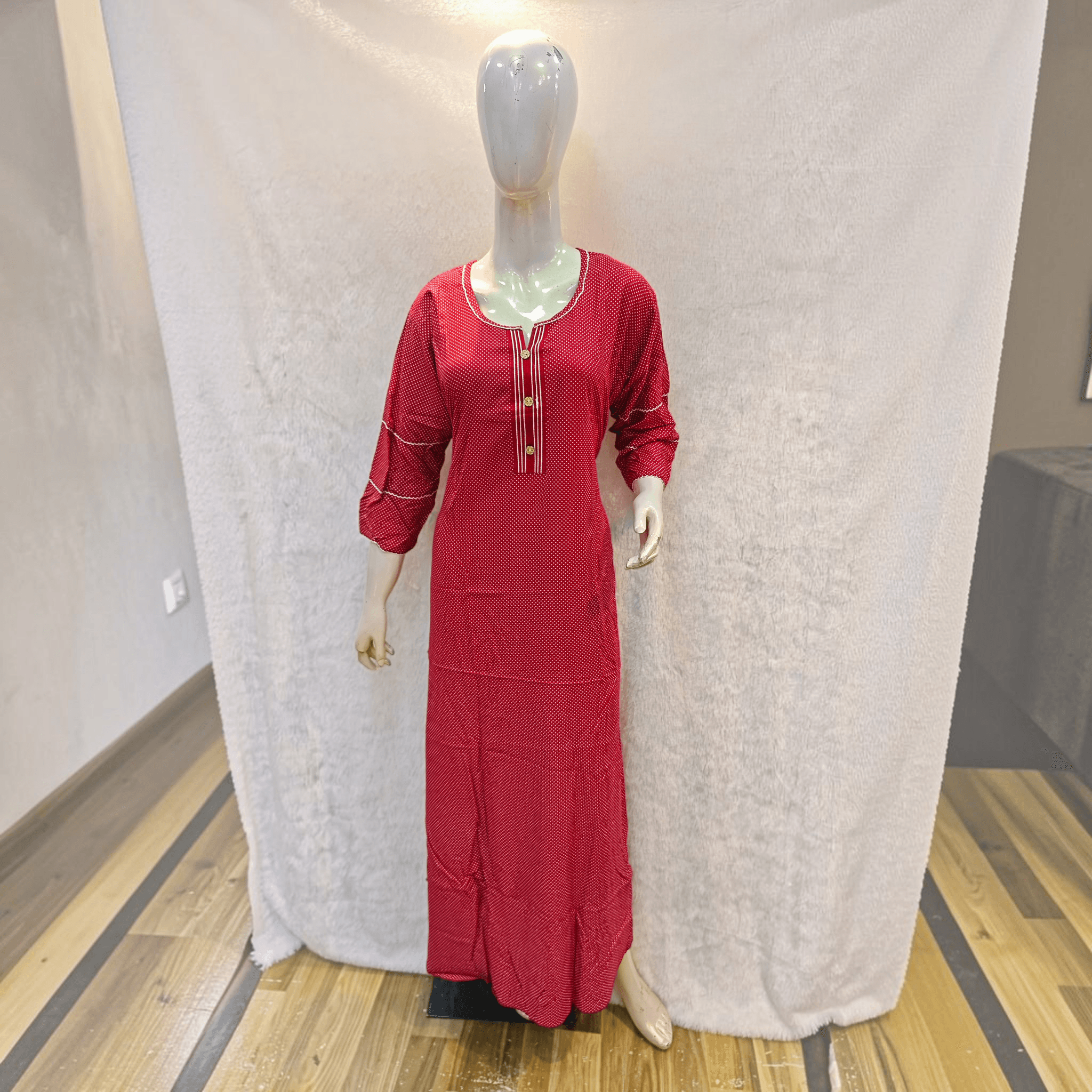 City Center red A-line gown in heavy rayon with white polka dots, three-quarter sleeves, and a button-down neckline.