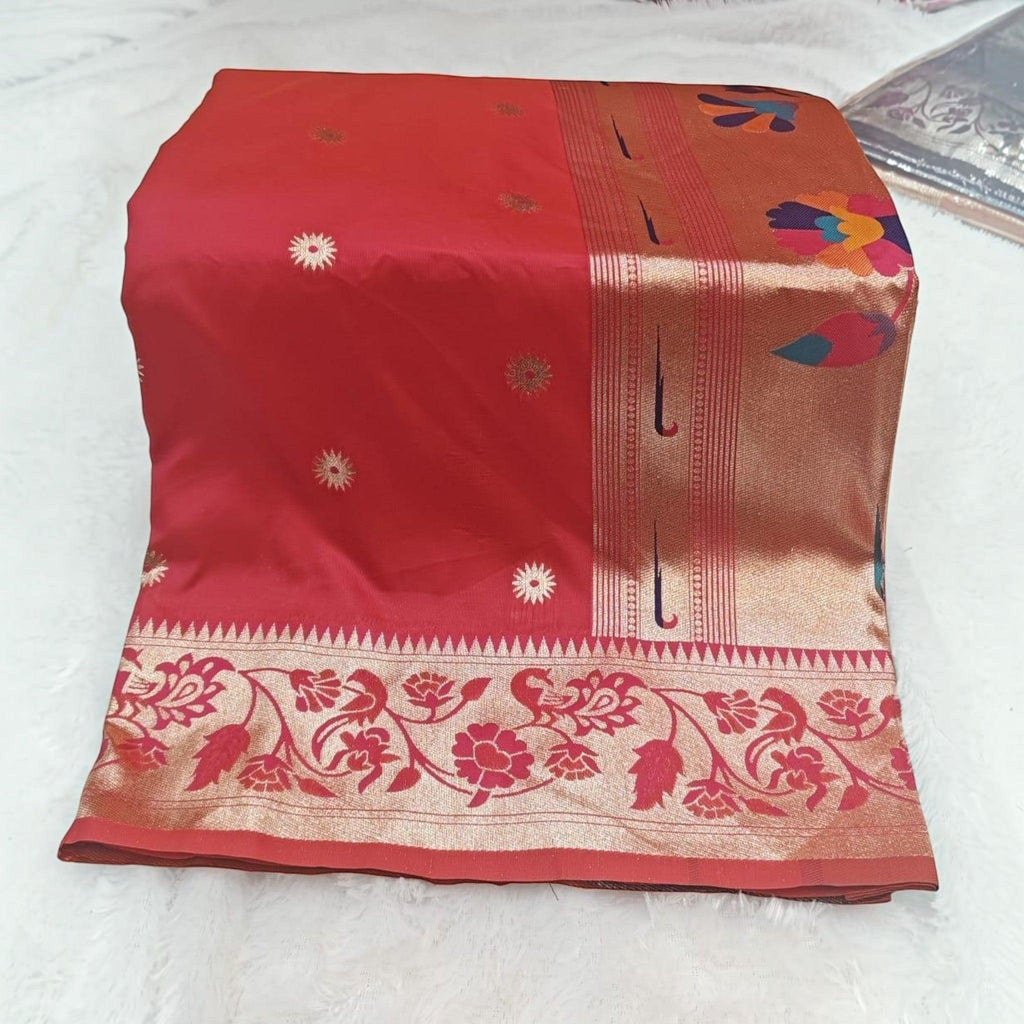 City Center red silk saree featuring gold floral motifs and an intricate peacock and floral woven border.