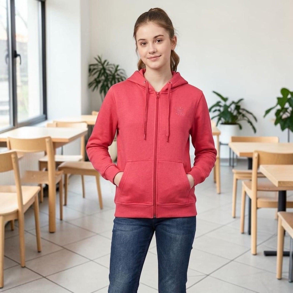 City Center red full-zip hooded sweatshirt with drawstring, front pockets, and chest graphic worn by a young woman.