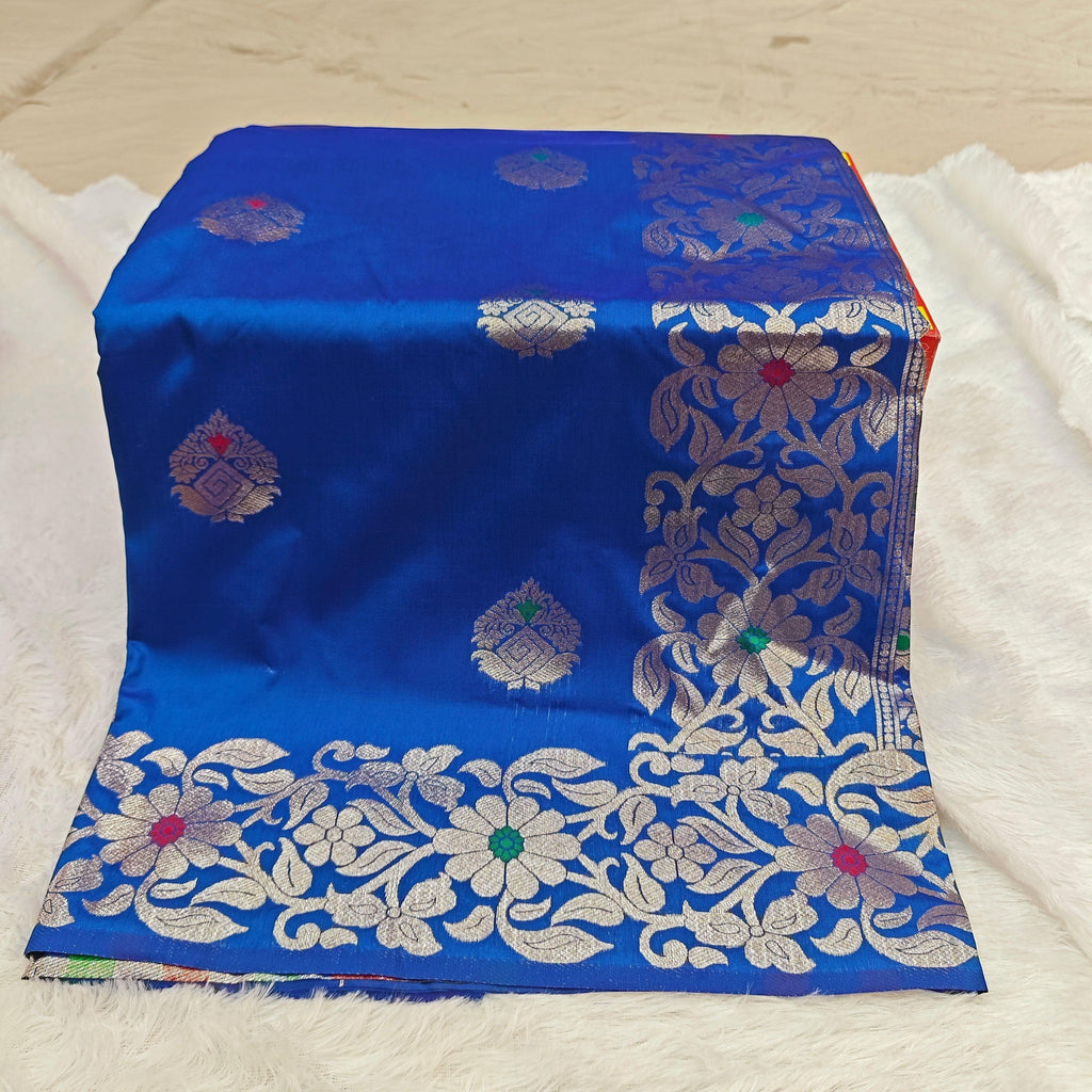 City Center royal blue silk blend saree featuring intricate silver zari floral motifs and colorful Mina threadwork.
