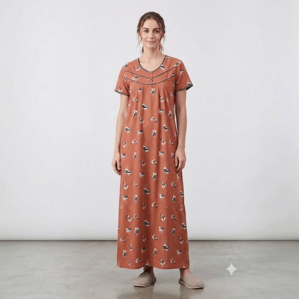 City Center women's rust-colored alpine fabric feeding gown with geometric print, neck embroidery, and pleats.