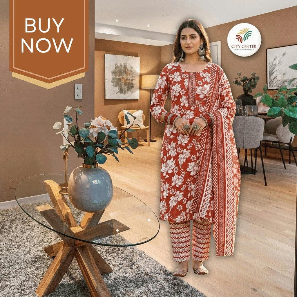 City Center cotton kurti set in rust orange with white floral Jaipuri print, worn by a model in a modern living room.
